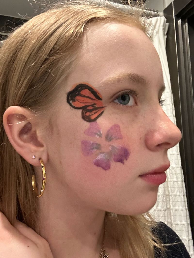 Butterfly wing and flower face paint design
